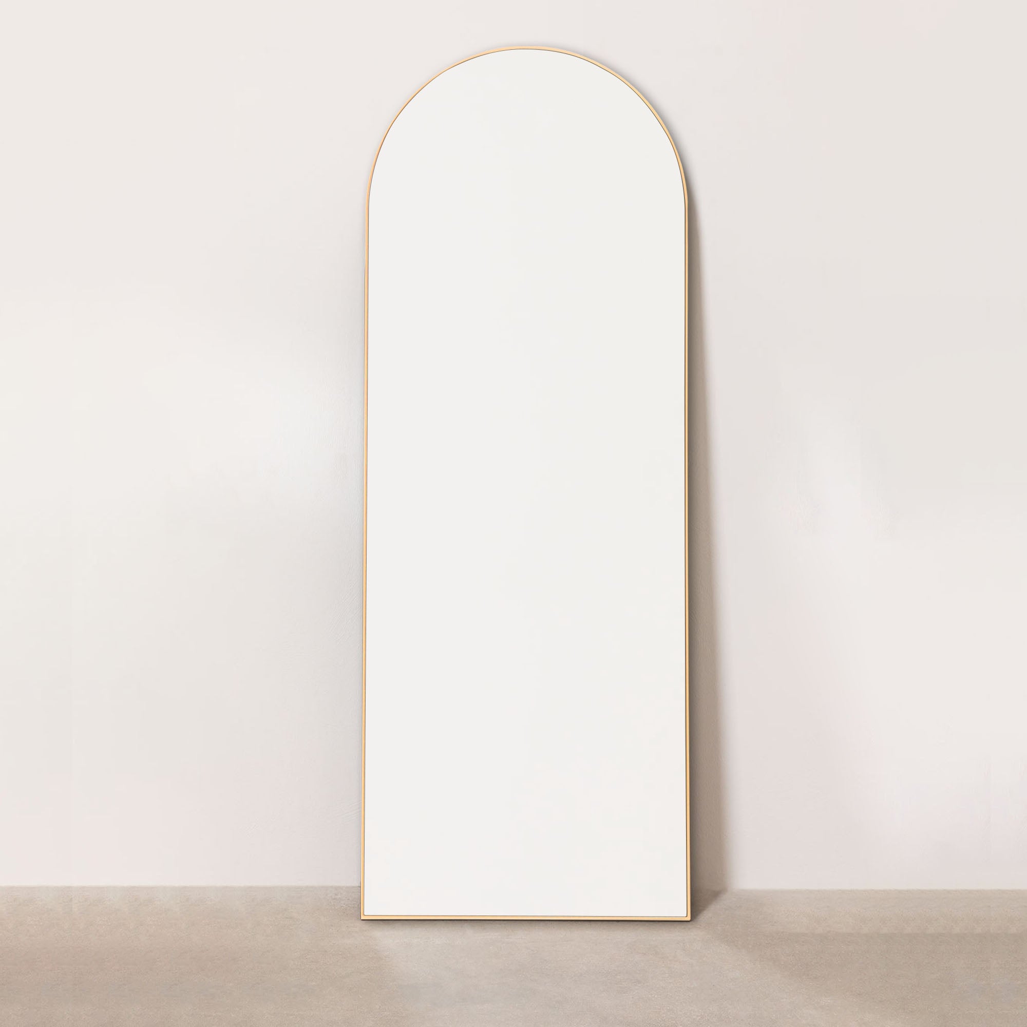 gold wood arch floor leaning mirror