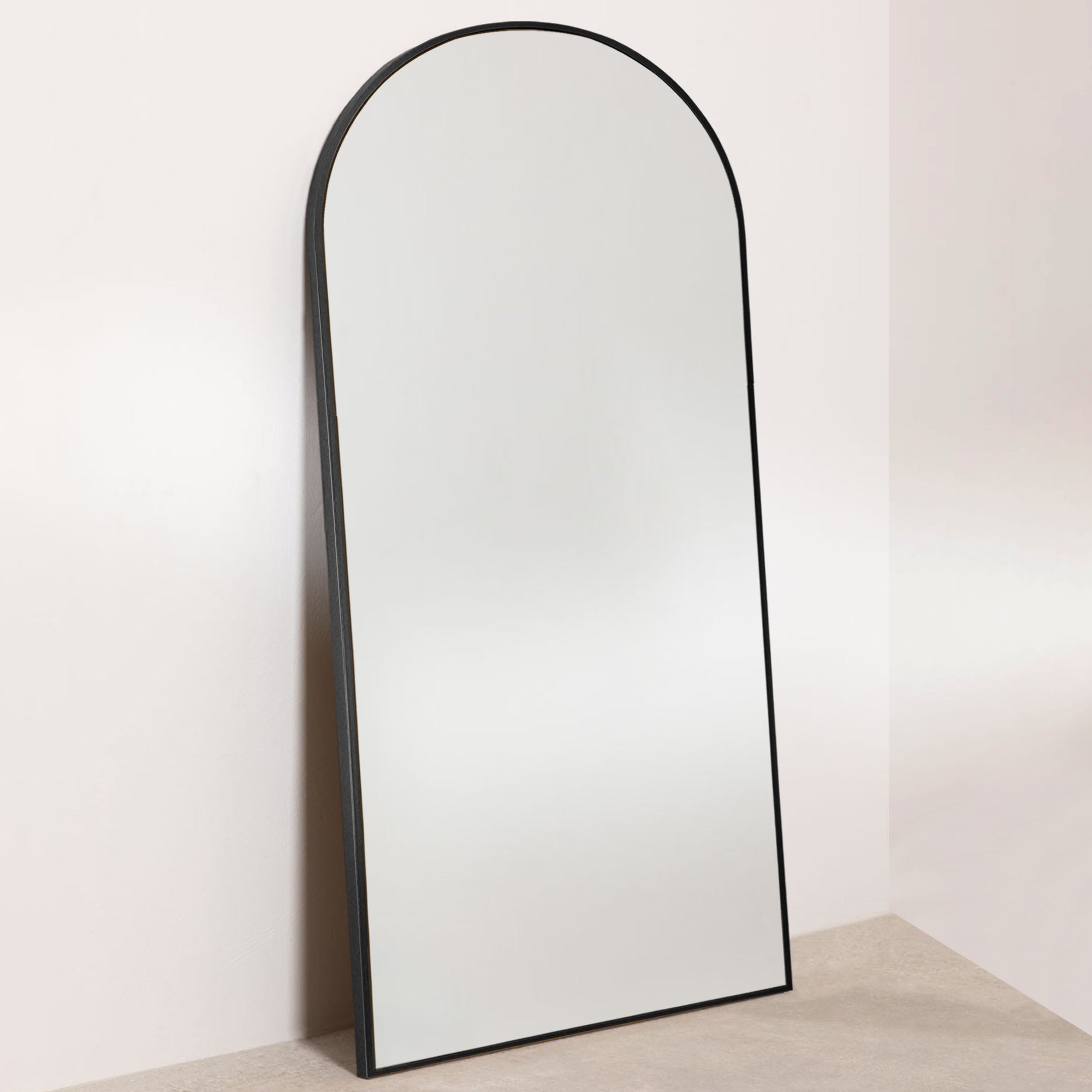 arched full length leaning mirror