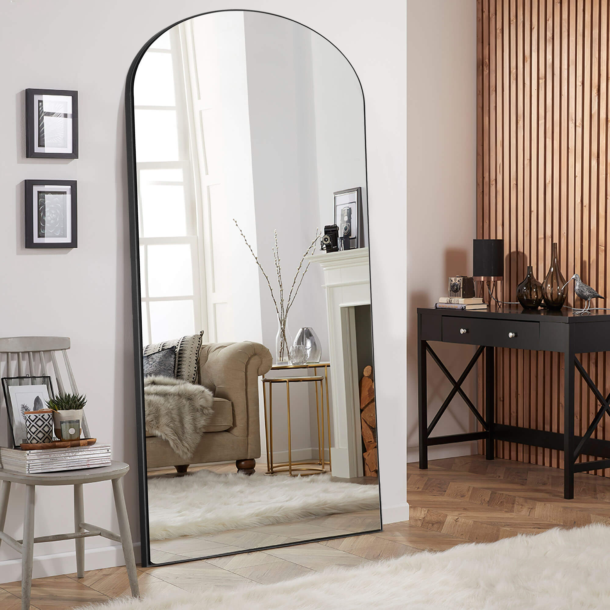 black wood frame arch leaning mirror