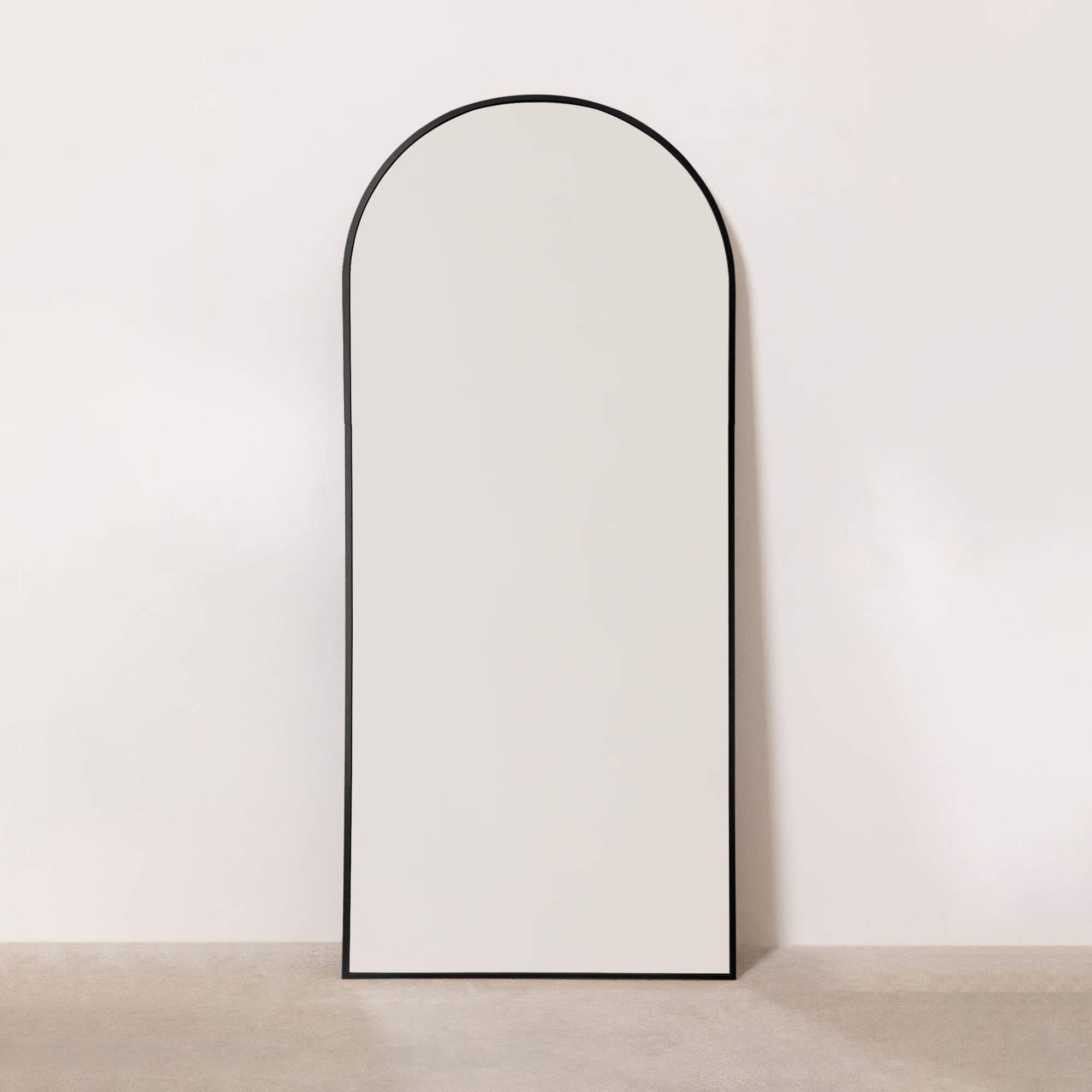 black decorative arch mirror